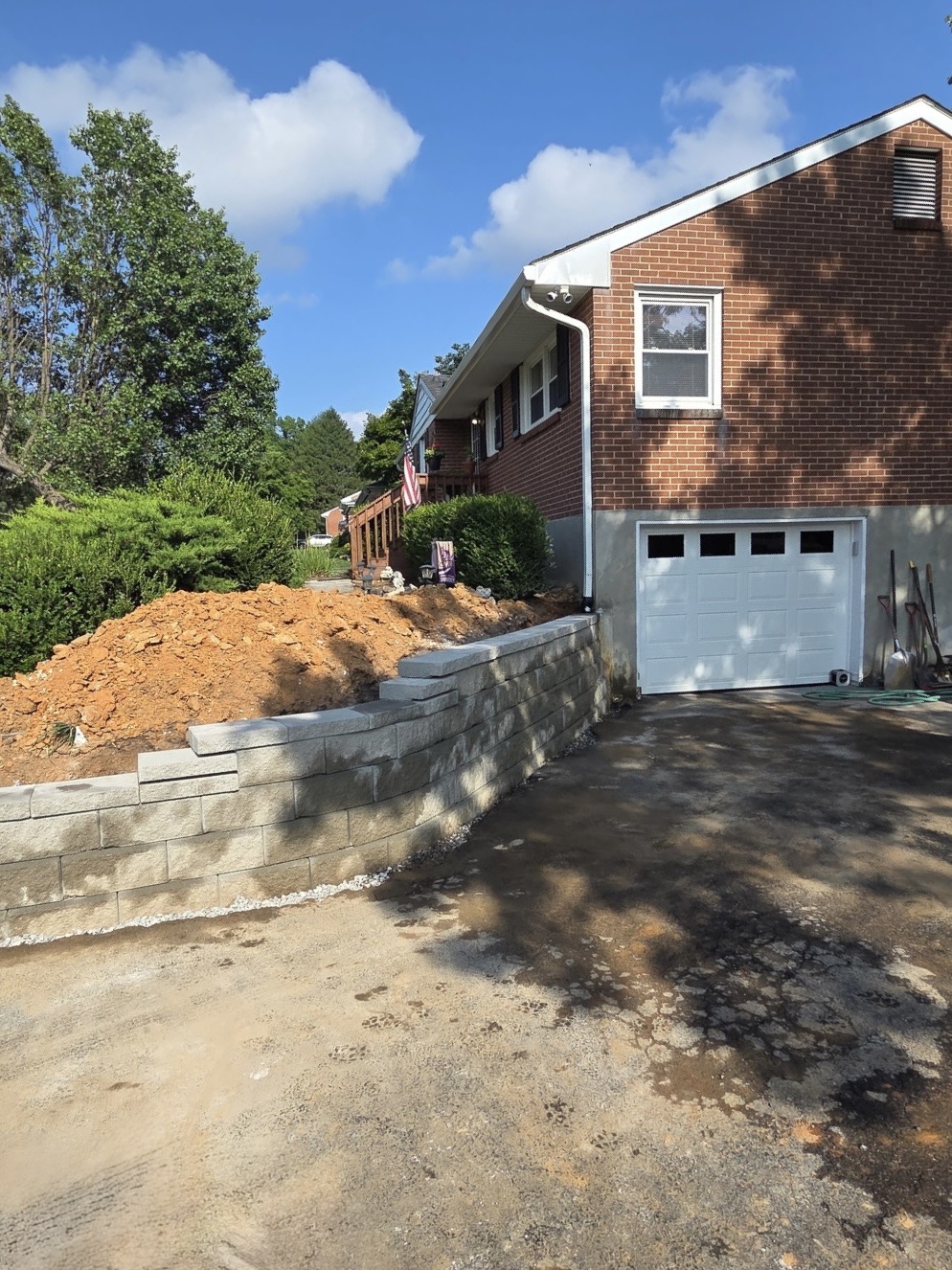 New segmental concrete block retaining wall being rebuilt with backfill underway, Roanoke, VA